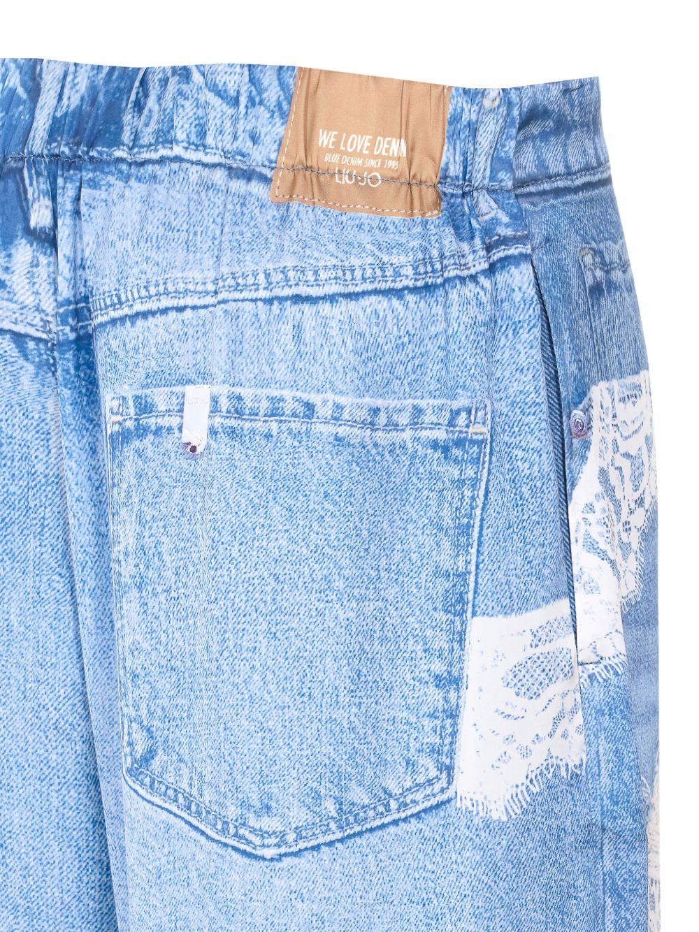 LIUJO Jeans con dettagli strappati e pizzo bianco 