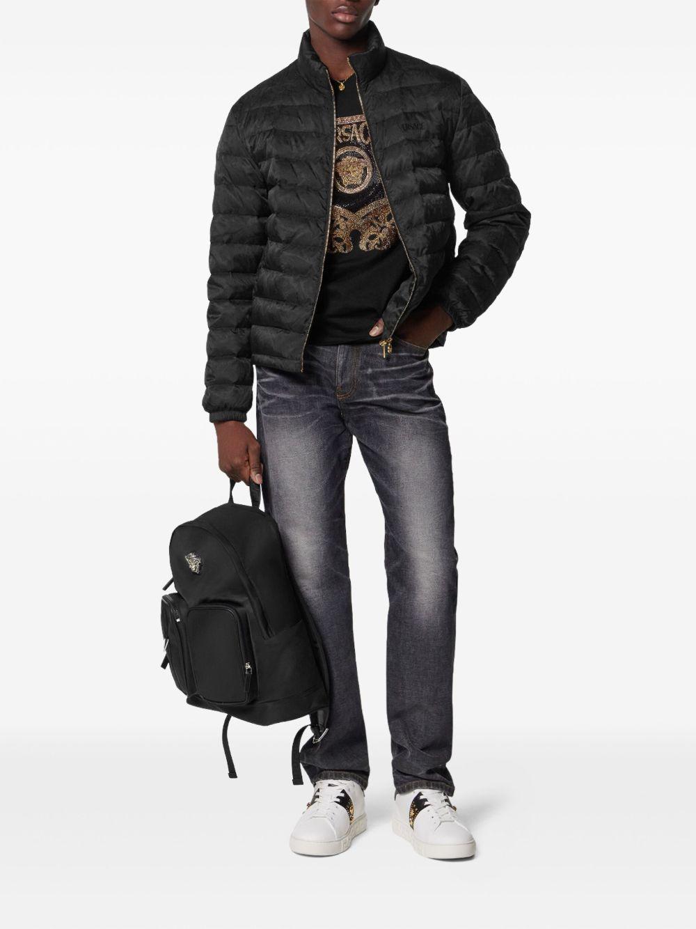 VERSACE Jeans neri slavati con dettaglio medusa 