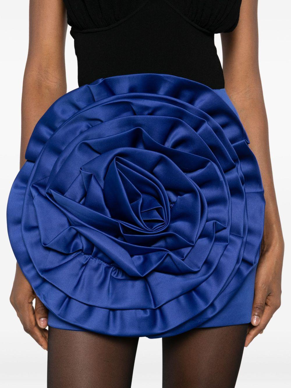 ROTATE Minigonna blu con applicazione fiore 
