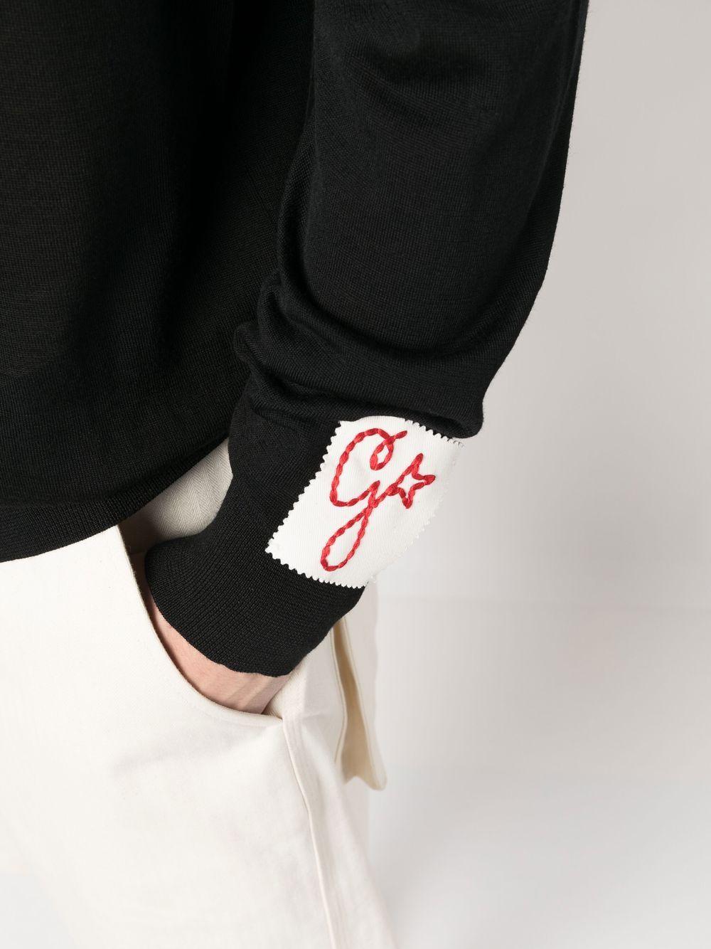 GOLDEN GOOSE Polo in lana vergine nera con etichetta con logo 