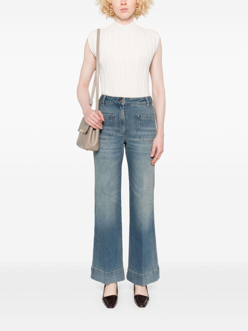 VICTORIA BECKHAM Jeans elasticizzati con applicazione logo 
