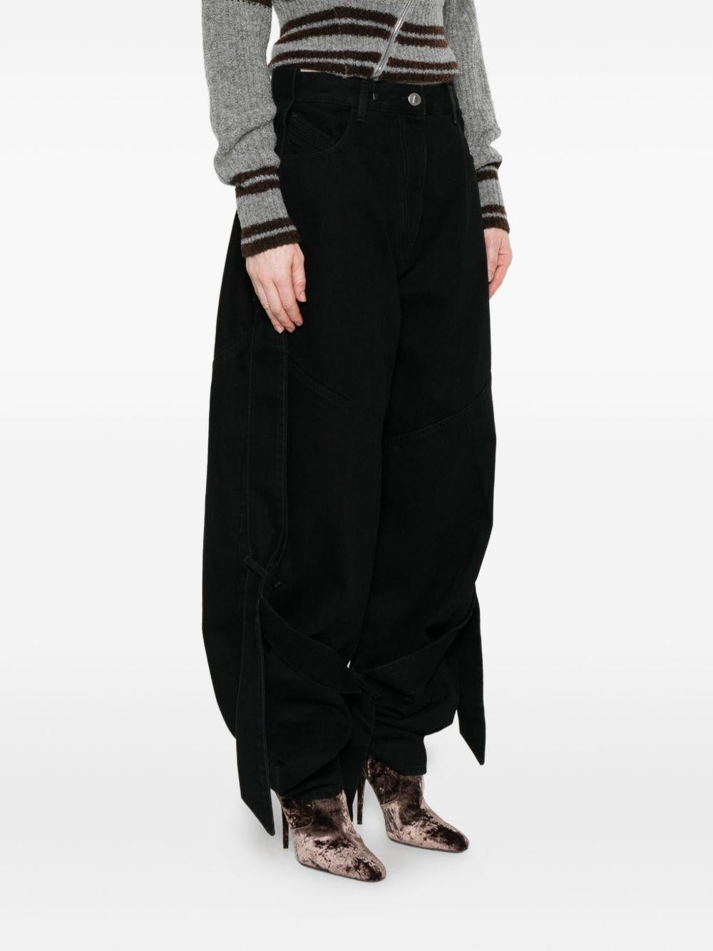 THE ATTICO Jeans neri con pannelli a contrasto e dettagli con laccetti annodati 