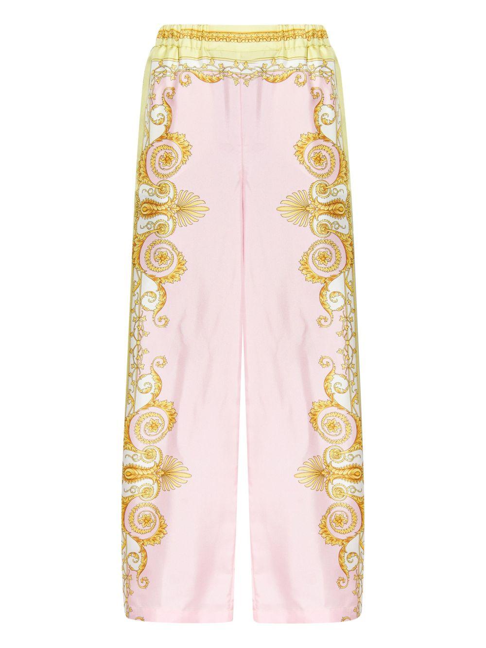 VERSACE Pantaloni in seta con stampa barocca rosa e oro 