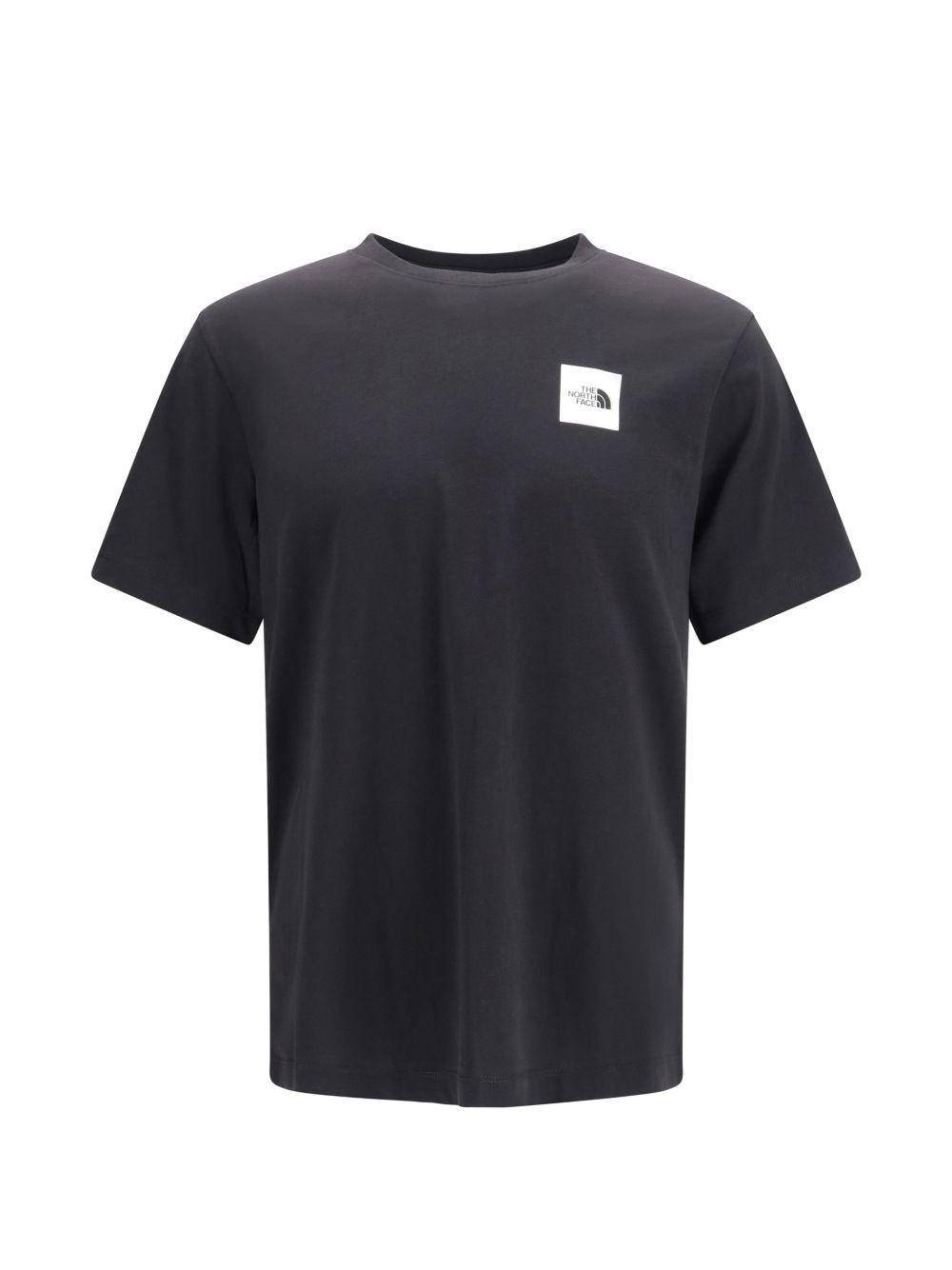THE NORTH FACE T-shirt in cotone nero con patch logo 