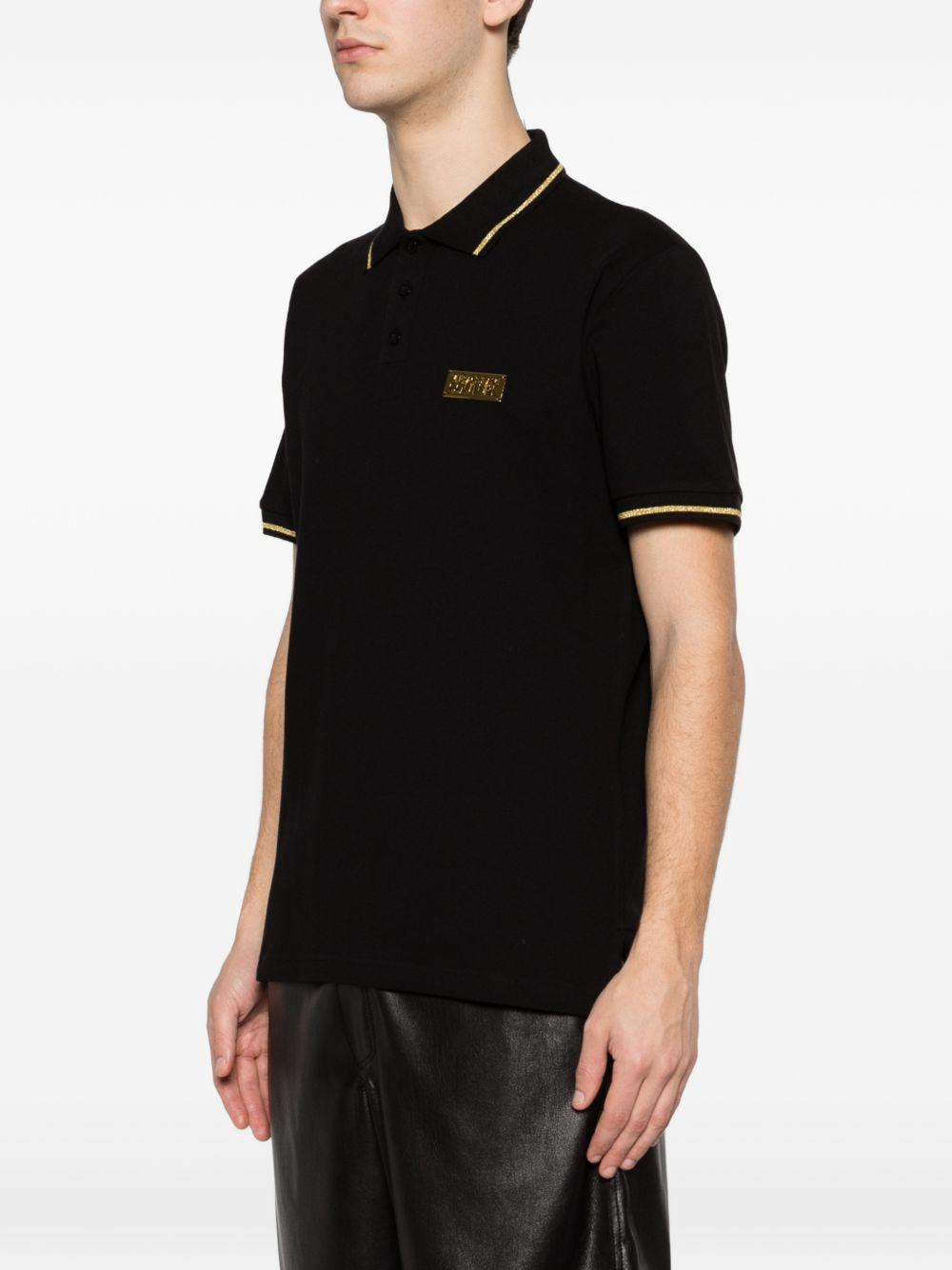 VERSACE JEANS COUTURE Polo nera con bordo a coste e logo 