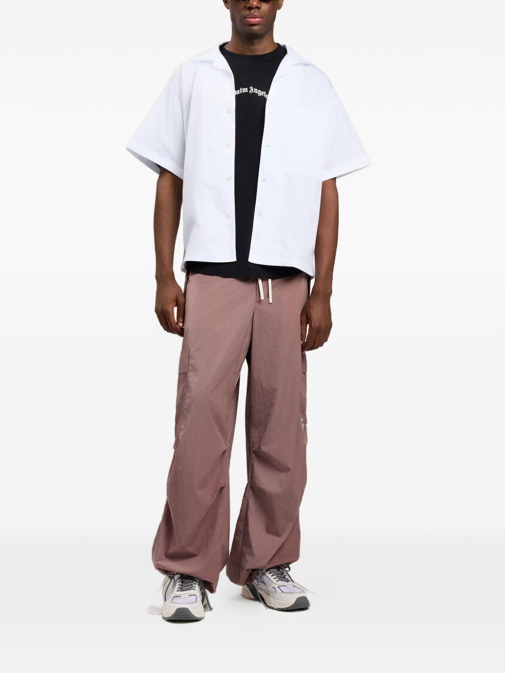 PALM ANGELS T-shirt oversize in cotone nero con logo bianco 