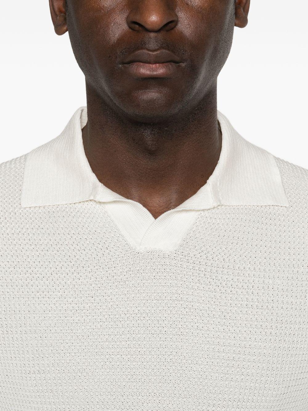 RAKKI T-shirt bianca con colletto polo 