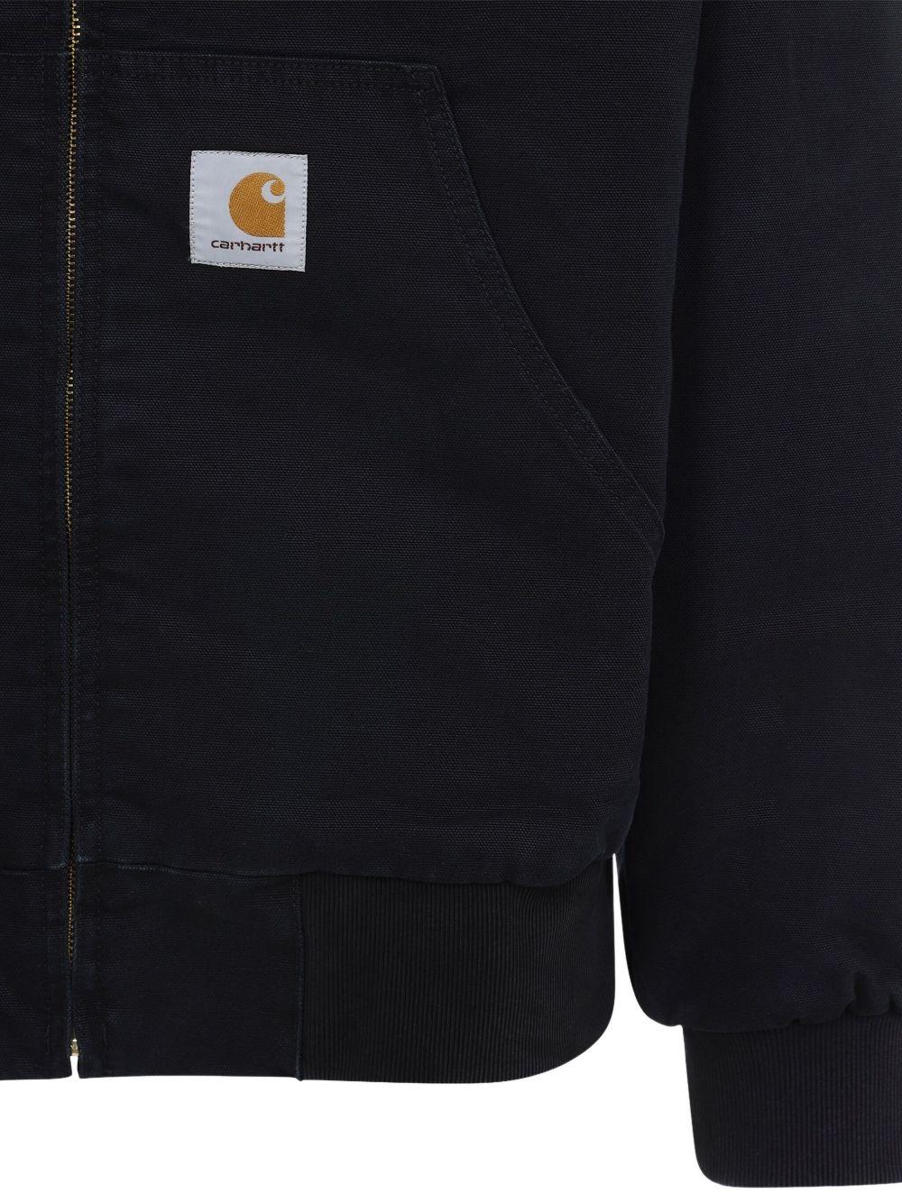 CARHARTT WIP Giubbotto nero con cappuccio e zip 