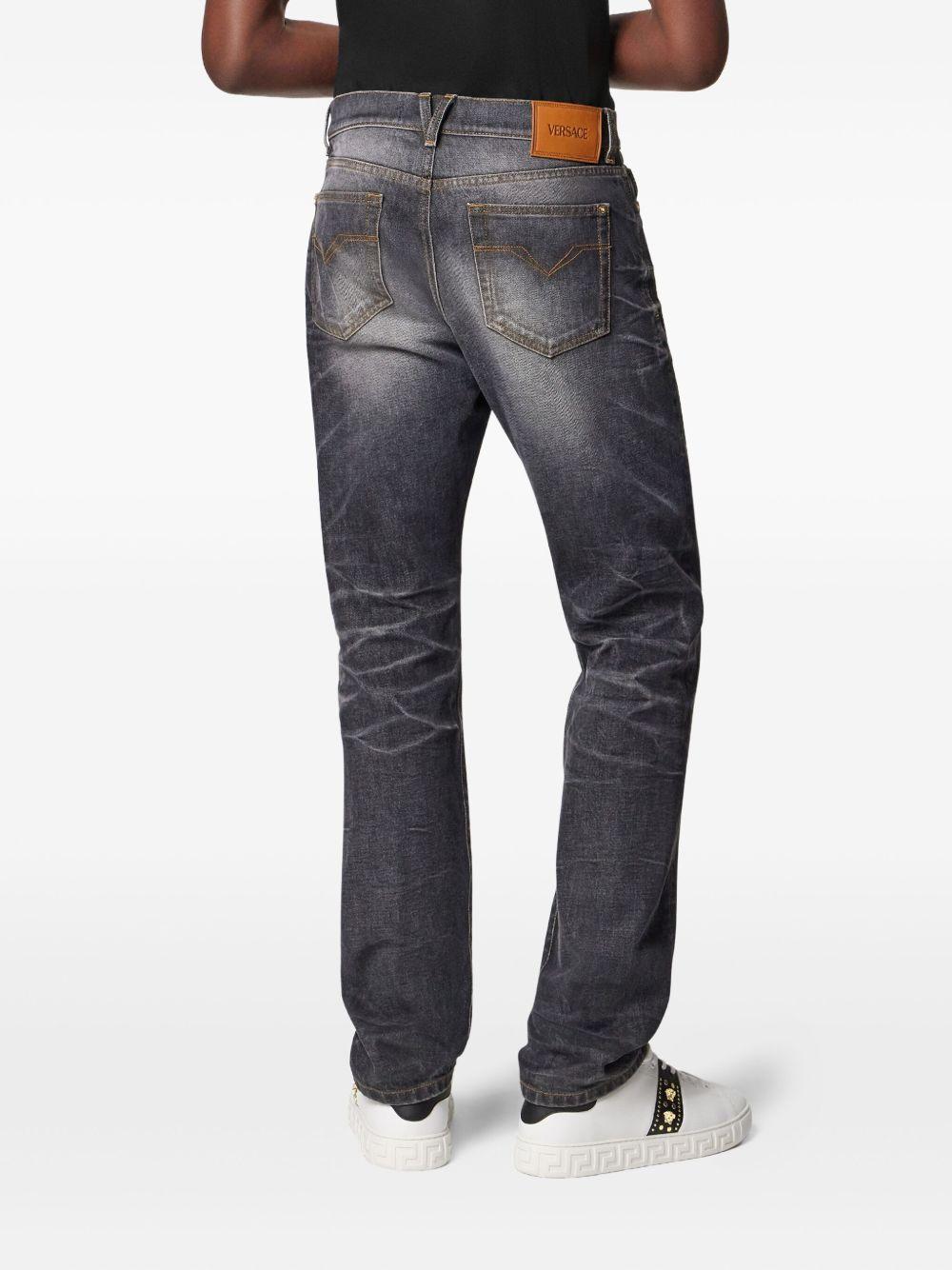 VERSACE Jeans neri slavati con dettaglio medusa 