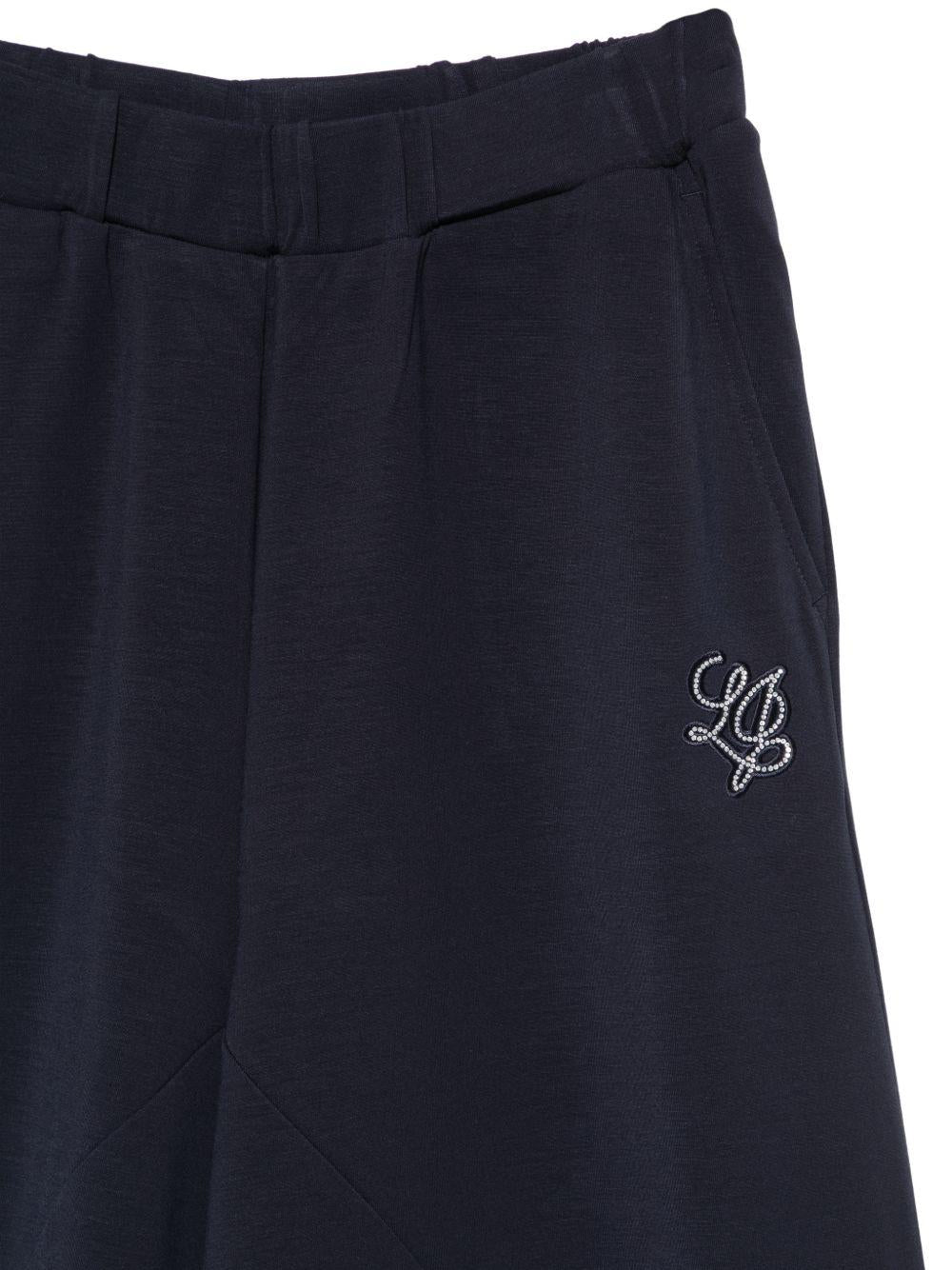 LIUJO Pantaloni in scuba blu navy con logo strass 